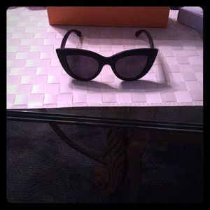 Black cat-eye sunglasses.